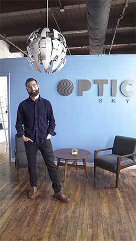 Aaron Gordon standing in front of an optics sign.