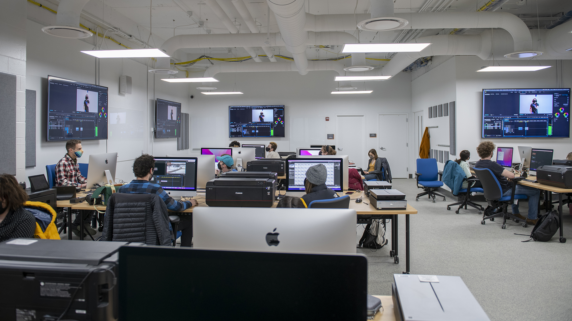 Students work on computers in a lab.