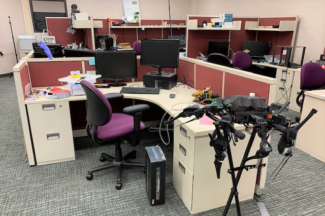 Desk stations with computers at each. 